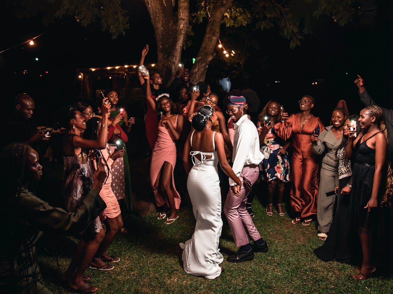 Guests celebrate with joy at a vibrant wedding in Nigeria's Federal Capital Territory.